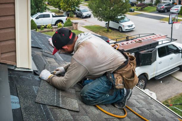 Professional Storm Damage Roof Repair technician working in Shorewood-Tower Hills-Harbert, MI